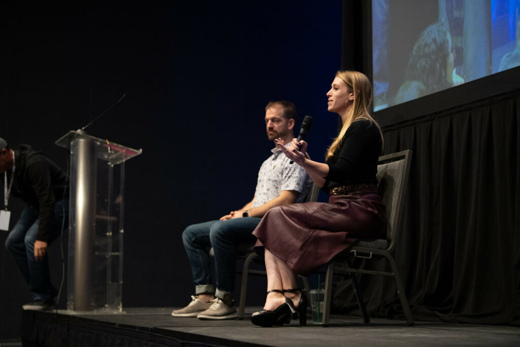 James Q. Quick and Emily Freeman talk during a panel discussion about Artificial Intelligence.