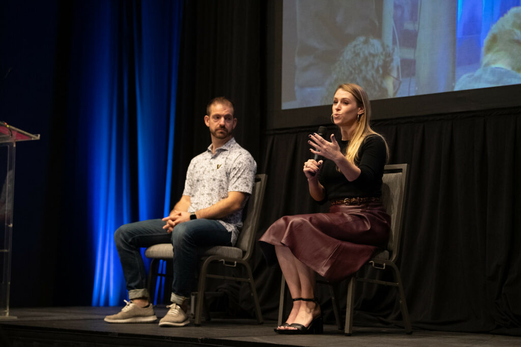 James Q. Quick and Emily Freeman sit on stage during a panel discussion about Artificial Intelligence