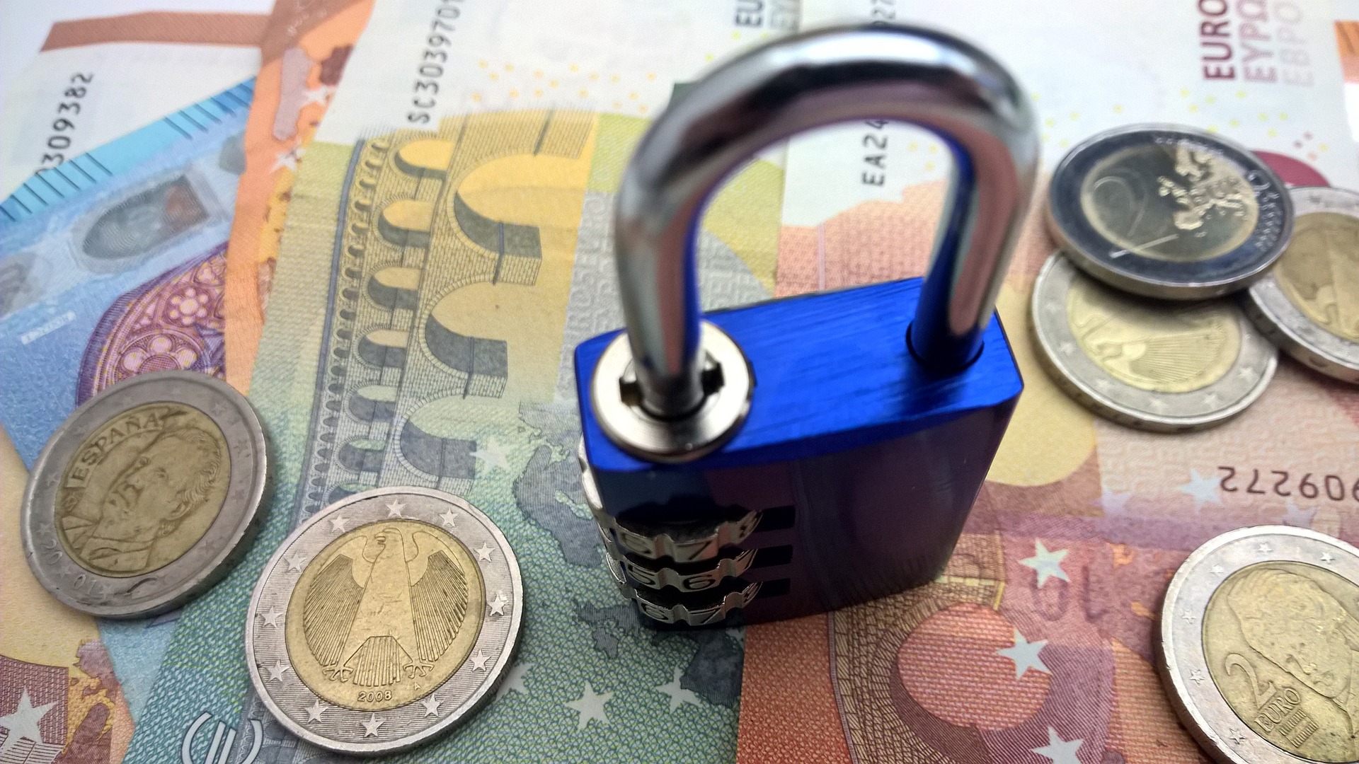 Lock on top of money and coins